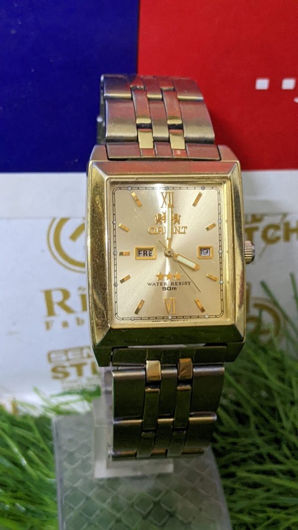 Vintage Orient NQAA-AO CS gold tone Automatic square day date Men's Wrist Watch