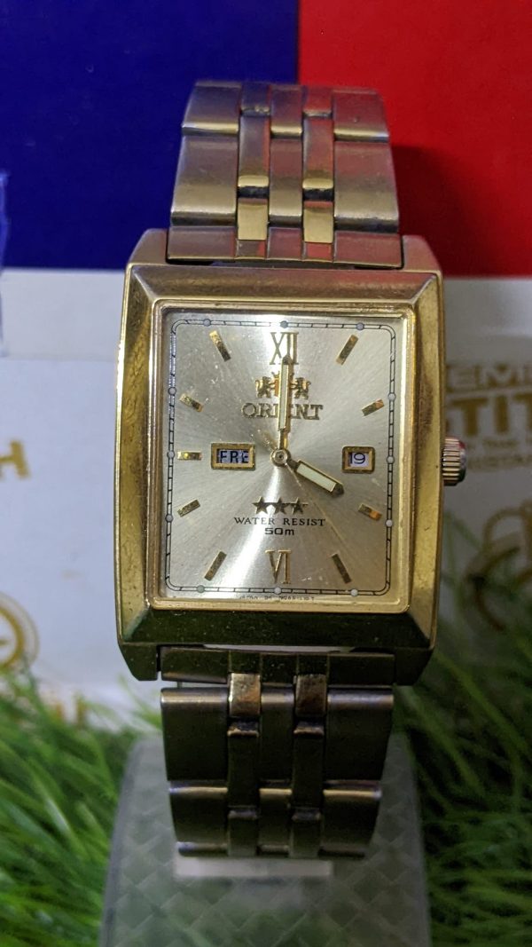 Vintage Orient NQAA-AO CS gold tone Automatic square day date Men's Wrist Watch